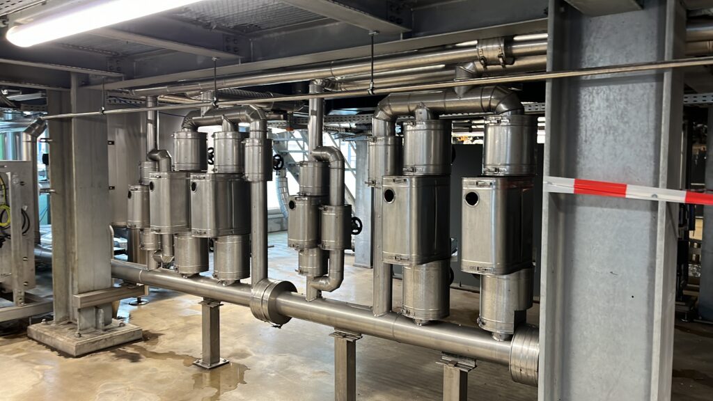 Industrial pipework with cylindrical protective cladding