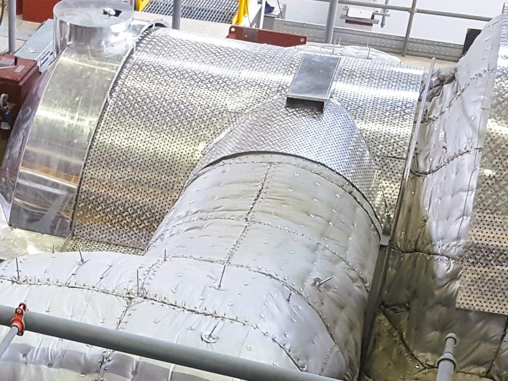 Insulated industrial equipment with fitted mattresses and protective metal cladding