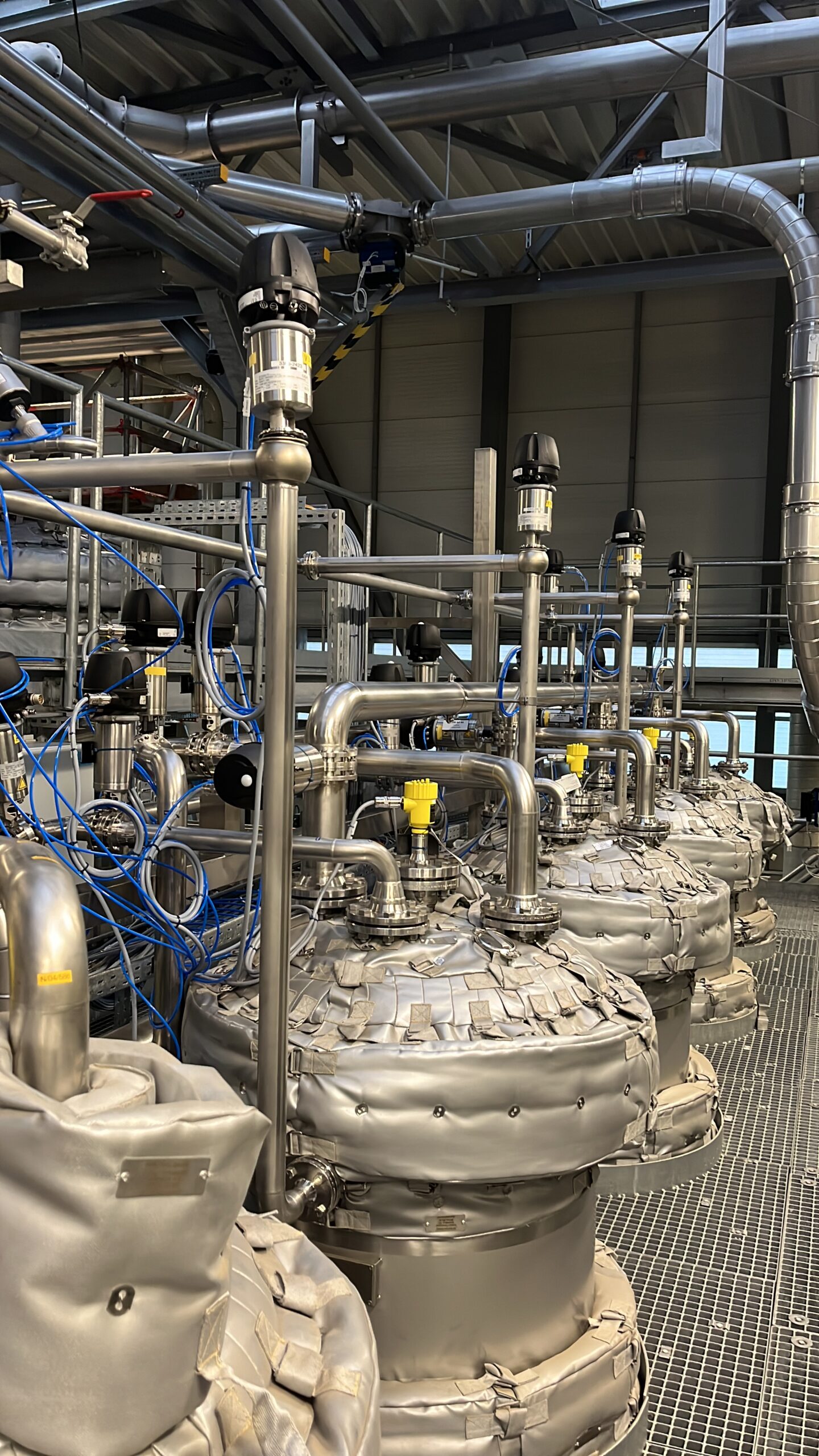 Industrial pipework, valves and insulation mattresses in a technical installation